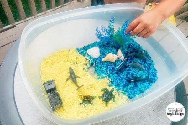 A tutorial on making beach-themed and ocean-themed sensory bin activity for toddlers and preschoolers.